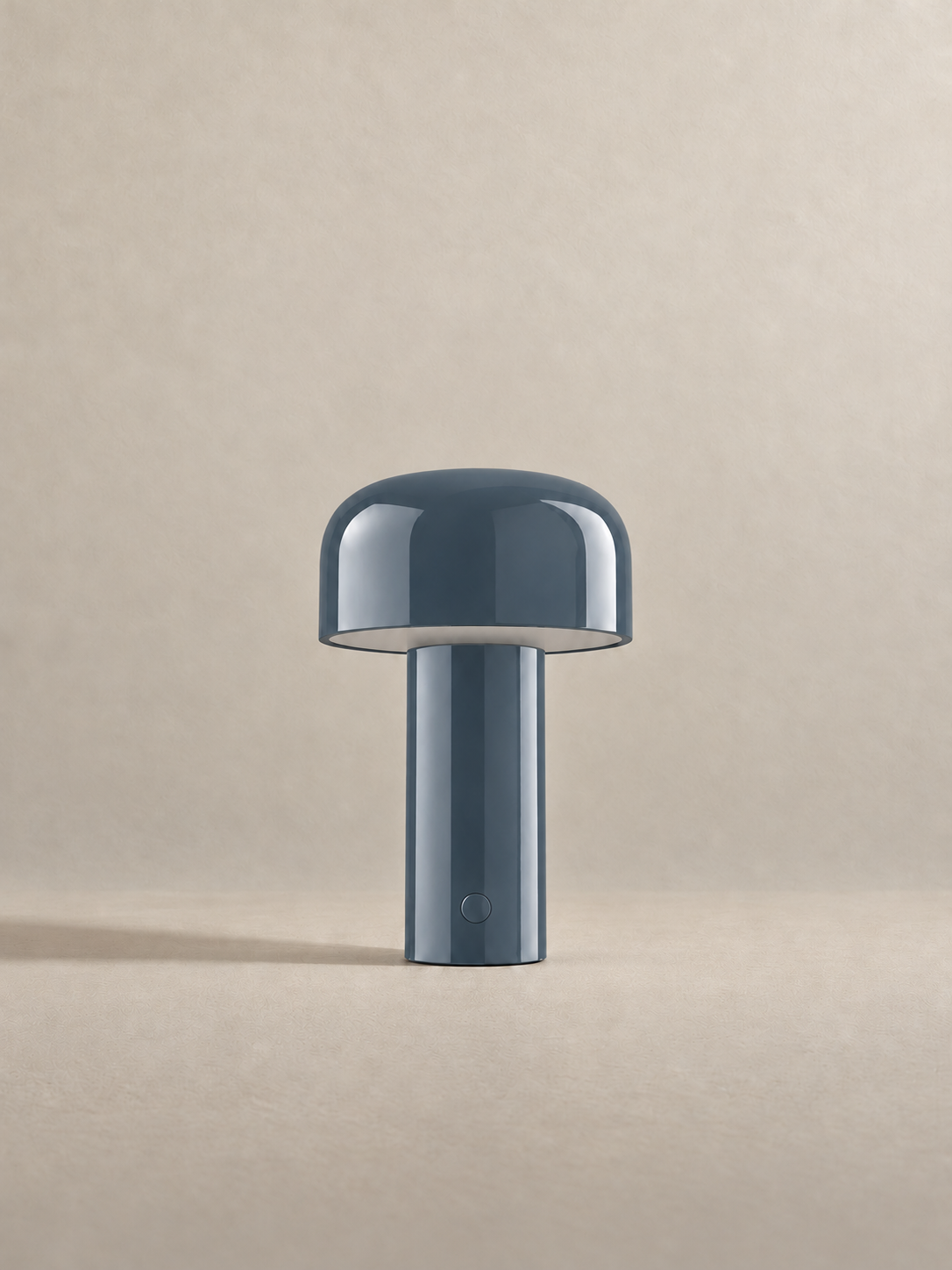 Portable dome lamp in Grey Blue, light off, warm neutral studio