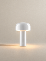 Portable dome lamp in White, light on, warm neutral studio