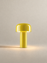 Portable dome lamp in Yellow, light on, warm neutral studio